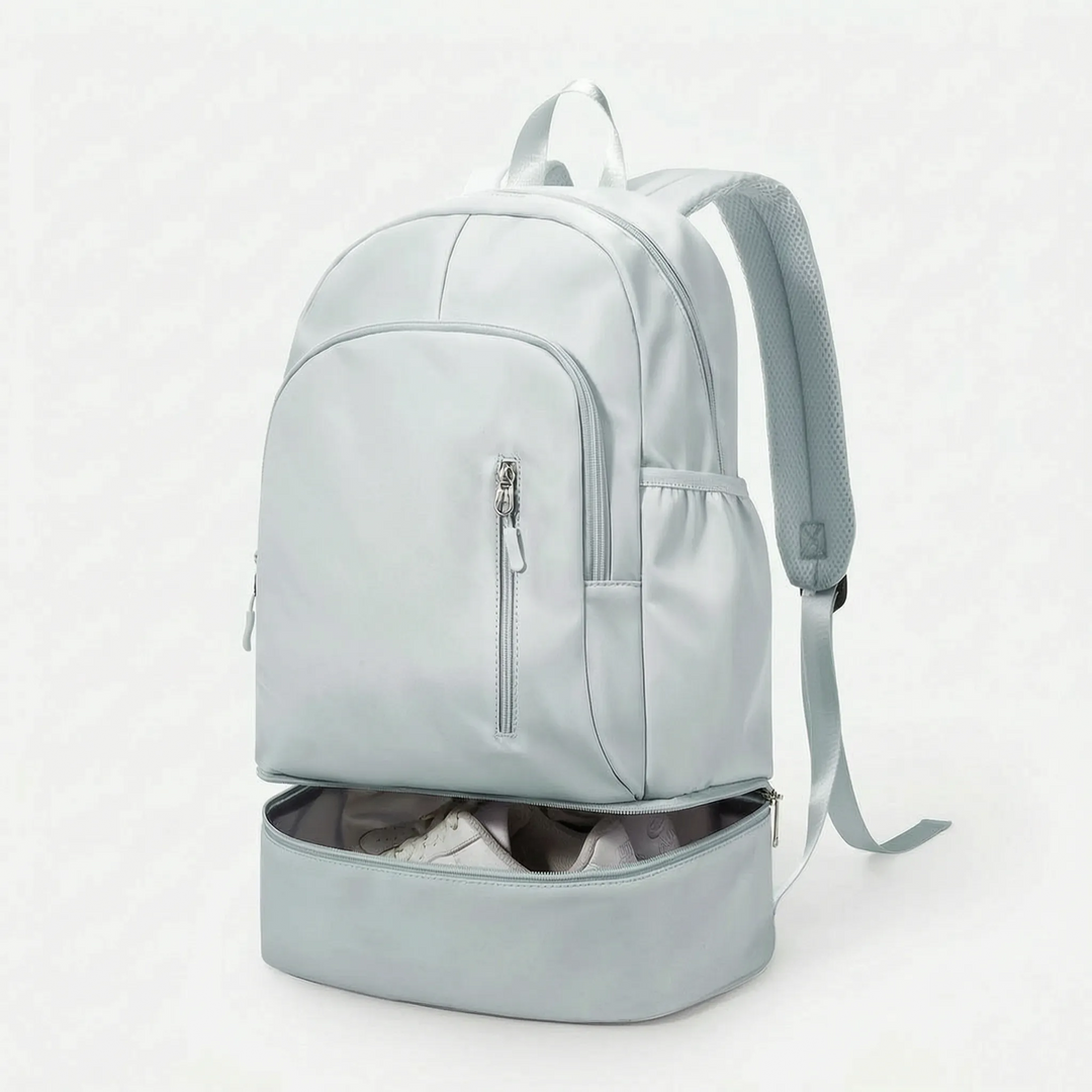 Black athletic backpack, a robust sports bag with an integrated shoe compartment, suitable for all daily activities.