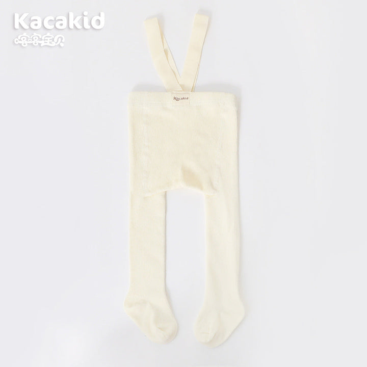 Close-up of the soft texture on unisex baby knitted high-waisted trousers, infant pants.