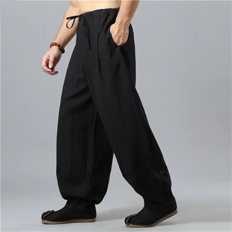 Stylish unisex loose fit lounge pants with drawstring waist, ideal for casual wear or streetwear comfort.