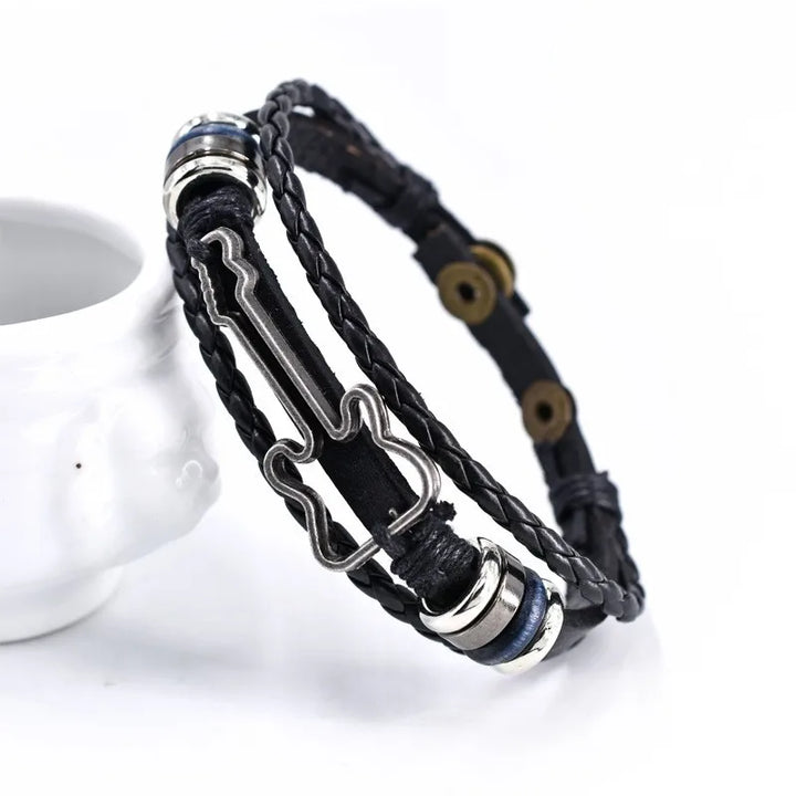Stylish unisex leather bracelet with bass guitar charm, ideal for musicians & music lovers. Comfortable jewelry gift.
