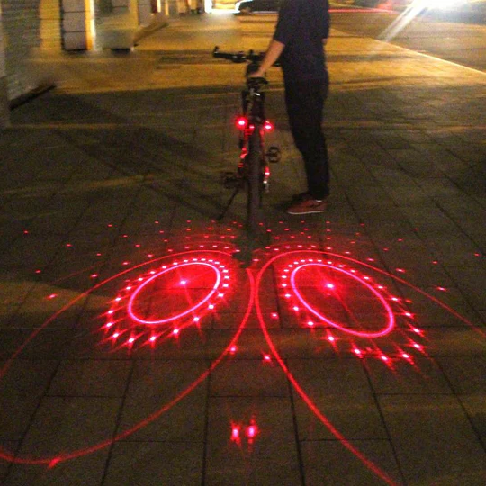 Rechargeable bike tail light providing superior cycling safety with laser projection for night riding visibility.