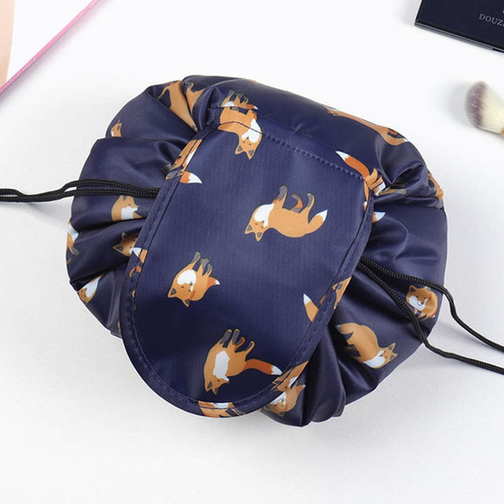 Hands holding an open drawstring cosmetic bag, showcasing ease of access to contents