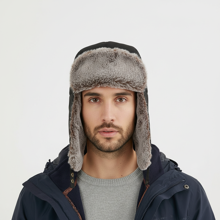 Close-up of a gray fleece winter beanie hat with ear flaps, showing the soft Sherpa lining for warmth