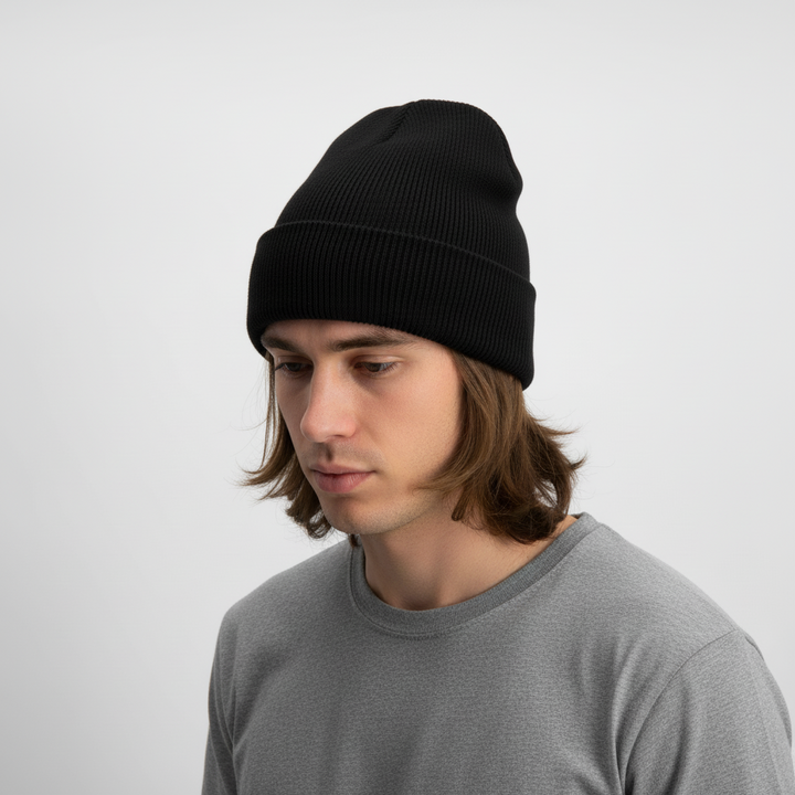 Stack of colorful knitted acrylic beanies, 'FrostKnit' embroidered, showcasing unisex winter hat options.