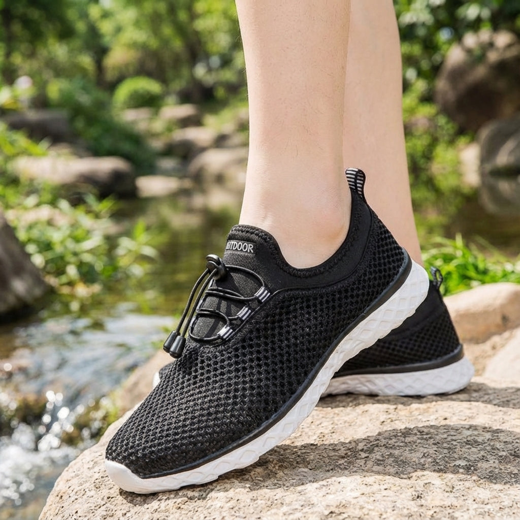Unisex black mesh sneakers 'Norman' from the side, showcasing breathable design ideal for active lifestyles.