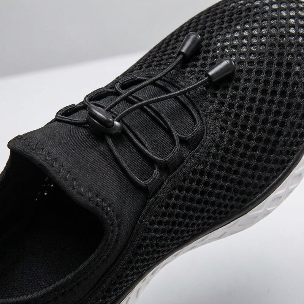 Close-up of the breathable mesh upper on 'Norman' unisex casual sneakers, emphasizing texture and ventilation.