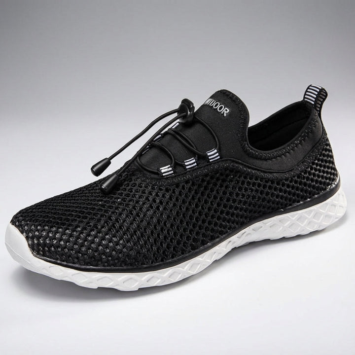 Unisex 'Norman' athletic shoes in a three-quarters view, demonstrating their comfortable and flexible walking design.