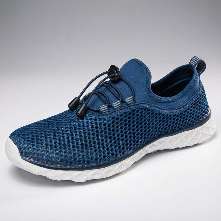 Bottom view of 'Norman' unisex mesh sneakers, showing the durable sole suitable for everyday and active wear.