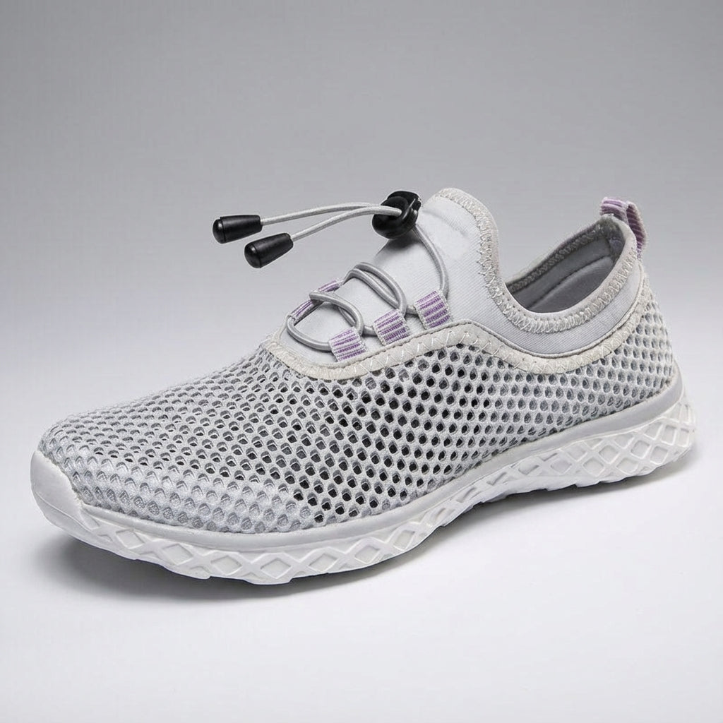 Side profile of 'Norman' unisex breathable footwear with a clean background, emphasizing sleek design and comfort.