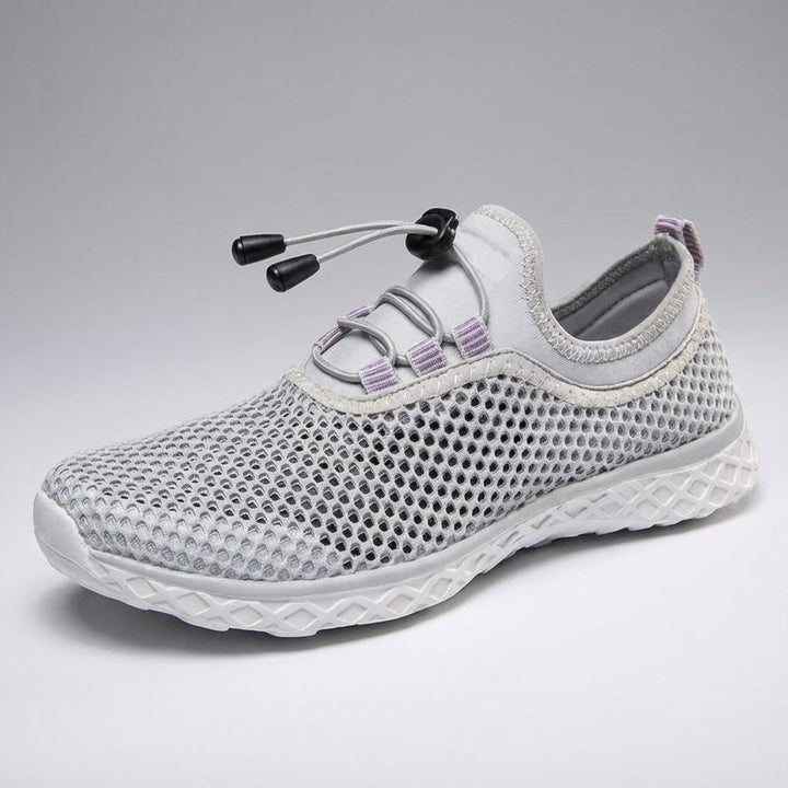 Side profile of 'Norman' unisex breathable footwear with a clean background, emphasizing sleek design and comfort.