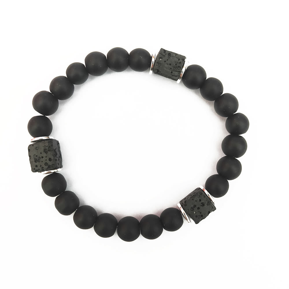 Adjustable unisex bracelet with black onyx and lava stone cubes, perfect for a minimalist, strong style.