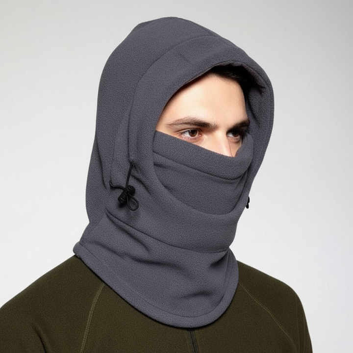 Person wearing a black unisex fleece hood and face mask, demonstrating its versatile cold weather protection.