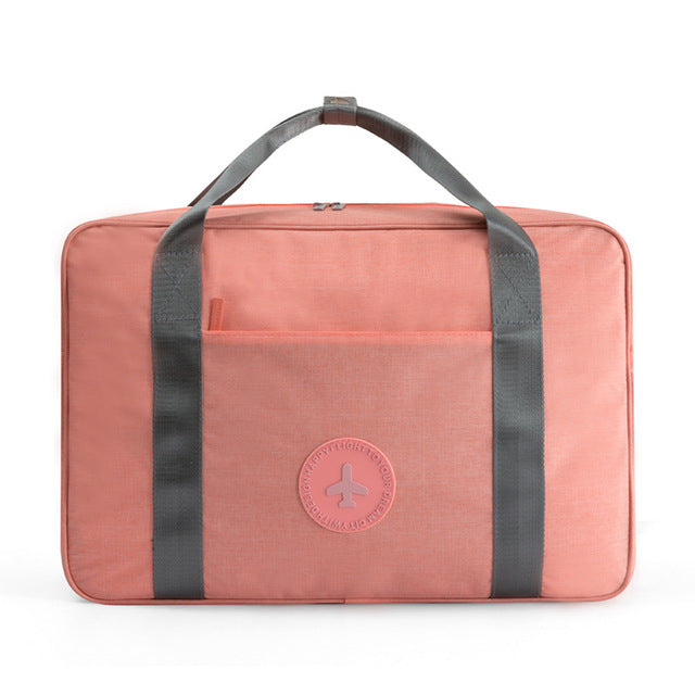 Versatile black unisex travel carry-on bag with shoulder strap, organized compartments, water-resistant