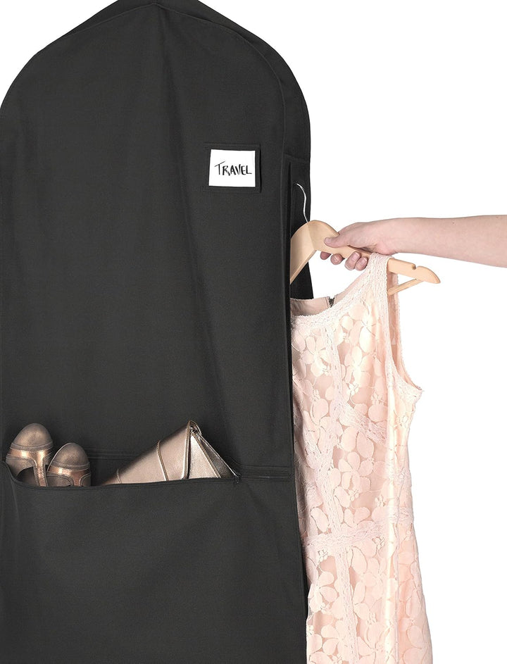 Garment bag with various travel accessories in its external pocket, ready for a trip