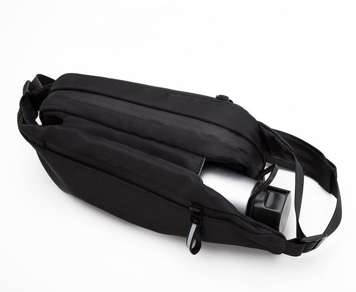 Hands-free multi-pocket fanny pack in black, perfect for sport, travel, and outdoor activities