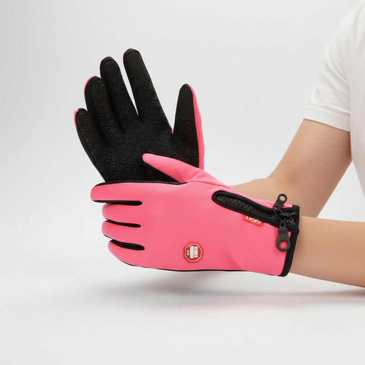 Person wearing black waterproof winter gloves, demonstrating touchscreen compatibility on a smartphone