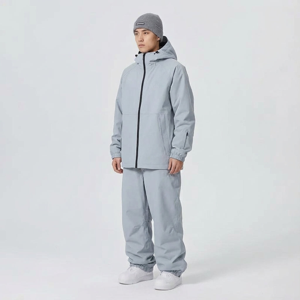 Side profile of model wearing Unisex Winter Ski Jacket & Pants Set, ready for slopes