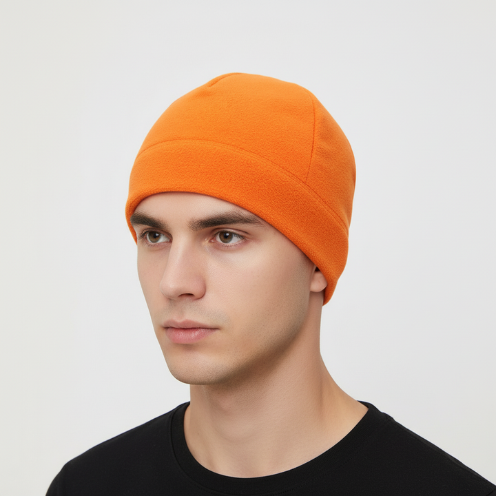 Close-up of the CozyShield logo on a windproof fleece beanie, a mark of quality outdoor gear