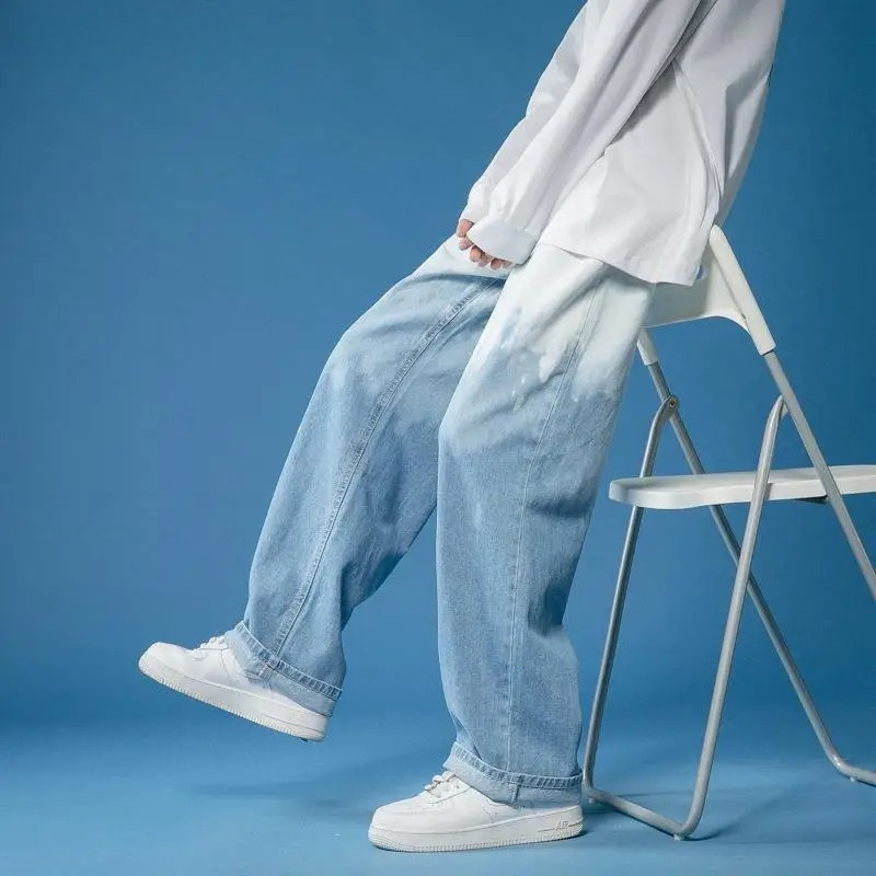Unisex bleach-dye wide-leg fade jeans, offering a relaxed fit and modern street style.