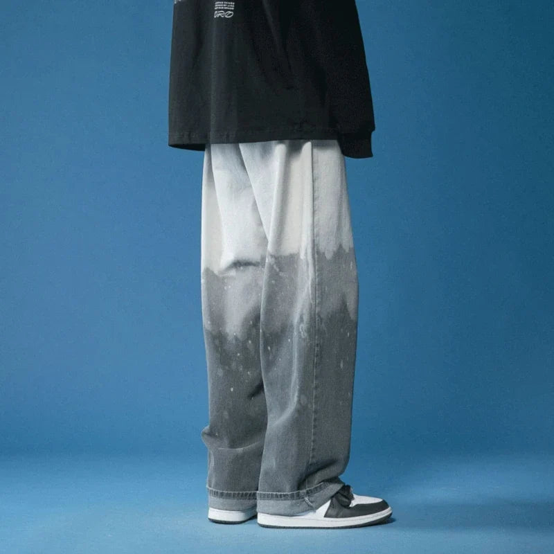 Fashionable unisex wide-leg fade jeans with an eye-catching bleach-dye design, a statement piece.