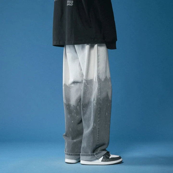Fashionable unisex wide-leg fade jeans with an eye-catching bleach-dye design, a statement piece.