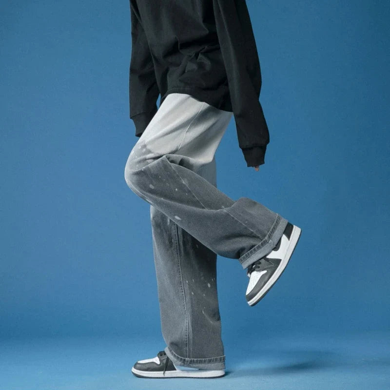 Effortless unisex wide-leg fade jeans featuring cool bleach-dye, ideal for versatile street style.