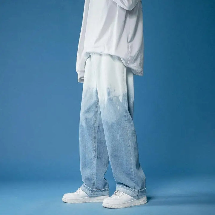 Unique acid wash bleach-dye fade on relaxed wide-leg unisex jeans, a distinctive modern look.