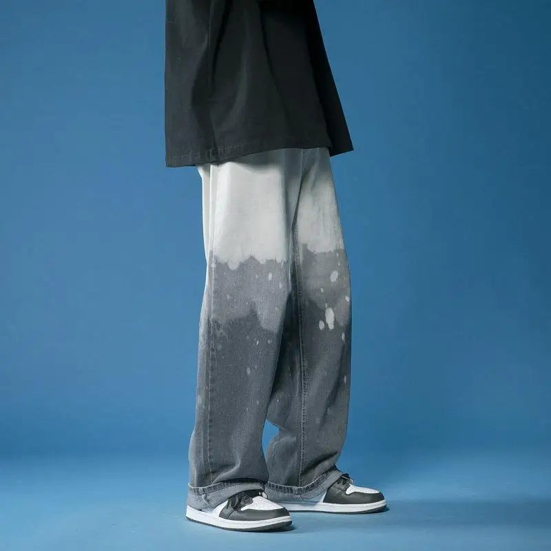 Stylish unisex wide-leg jeans with a striking bleach-dye fade effect, perfect for a casual outfit.