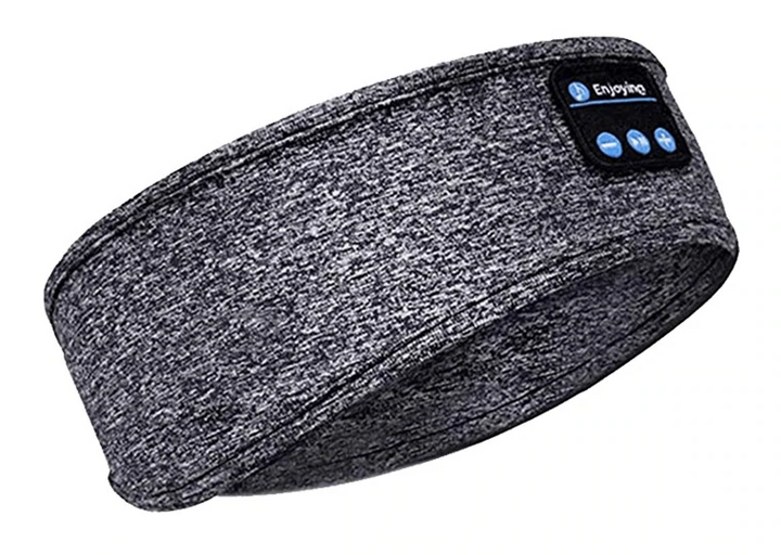 Person wearing a unisex Bluetooth sleep mask, relaxing. Soft audio eye mask for meditation.