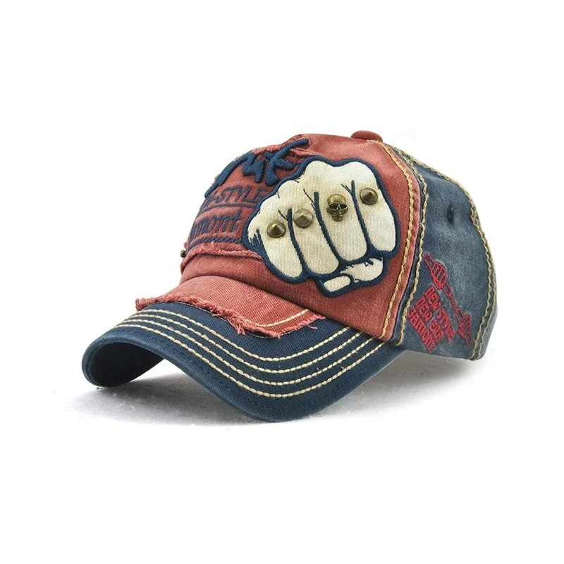 Rebel style unisex denim baseball cap with a striking embroidered fist and decorative metal studs.