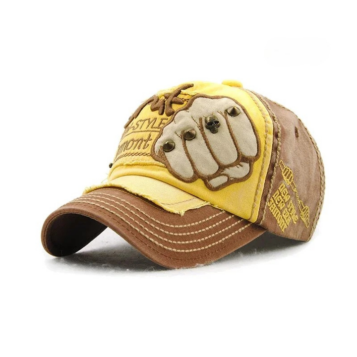 Cool unisex denim baseball cap with a detailed embroidered fist and metal studs, a unique bold accessory.