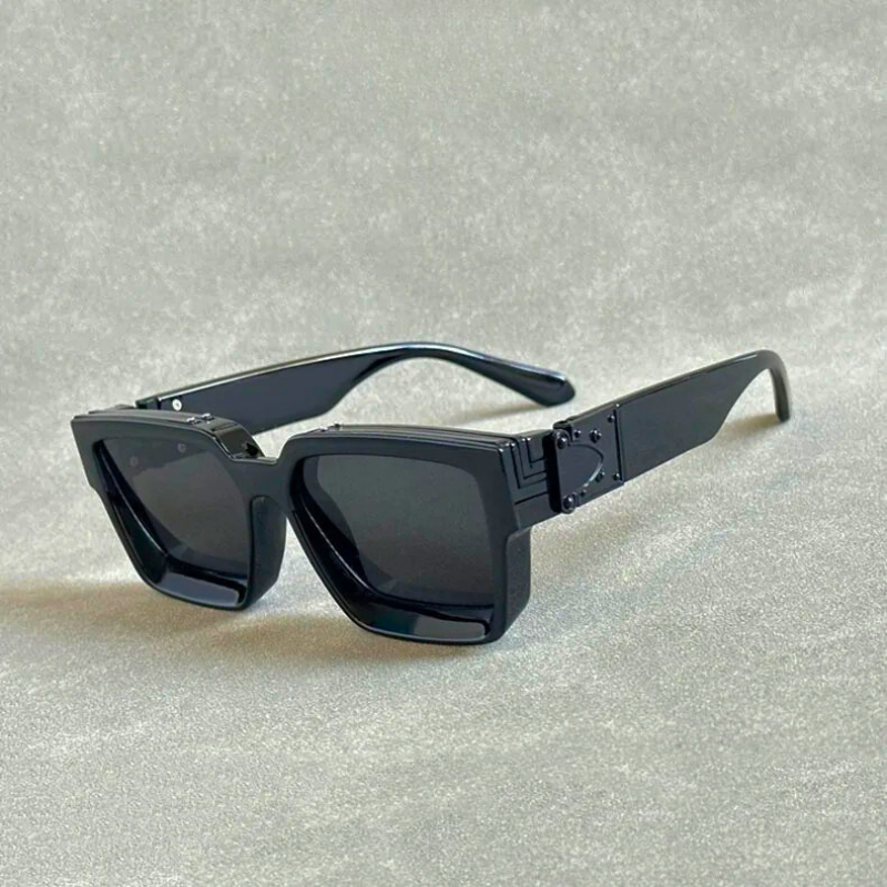 Close-up of bold metallic unisex sunglasses showcasing UV protection lenses & statement fashion design.