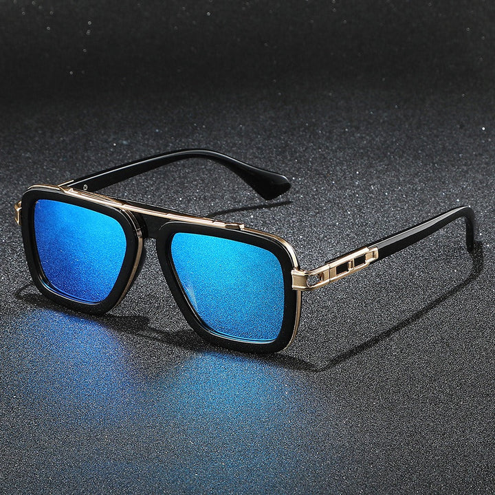 Unisex Bold Monarc sunglasses with squared frames, reflective lenses & UV protection. Essential fashion eyewear.