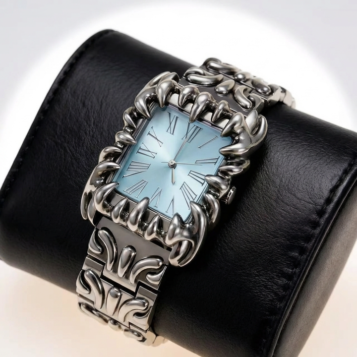 Close-up of a stylish quartz wristwatch dial featuring irregular Roman numerals & bold design.