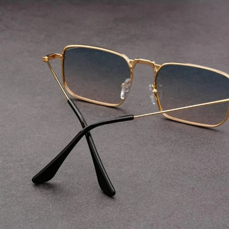 Trendy bold rectangular sunglasses, unisex, metal frame, essential for stylish eye protection.