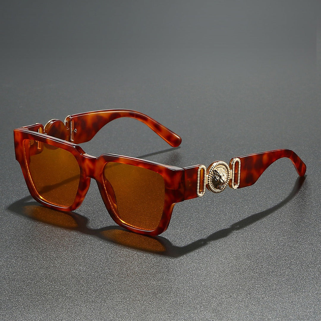 Close-up of bold square fashion sunglasses. Unisex statement eyewear for sun protection & style.