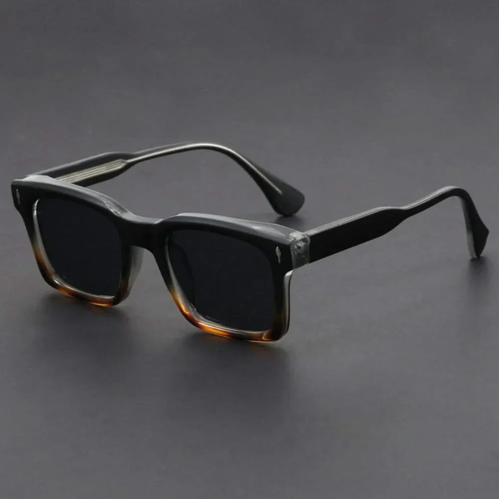 Unisex polarized sunglasses with a bold square frame, offering essential UV protection and anti-glare for travel.