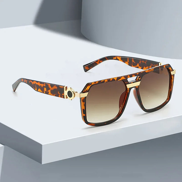 Tortoiseshell bold square sunglasses with gradient lenses and UV400 protection. Fashionable unisex eyewear.
