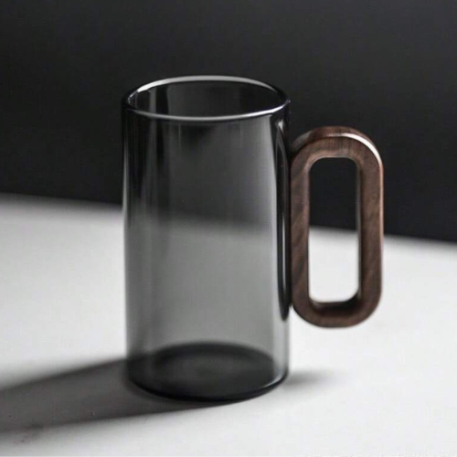 Modern borosilicate glass mug with ergonomic walnut handle. Ideal for espresso, coffee & hot beverages.