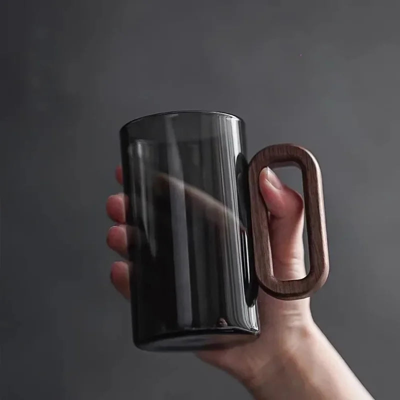 Durable borosilicate glass mug, dishwasher safe, featuring a unique walnut wood handle. Great drinkware.
