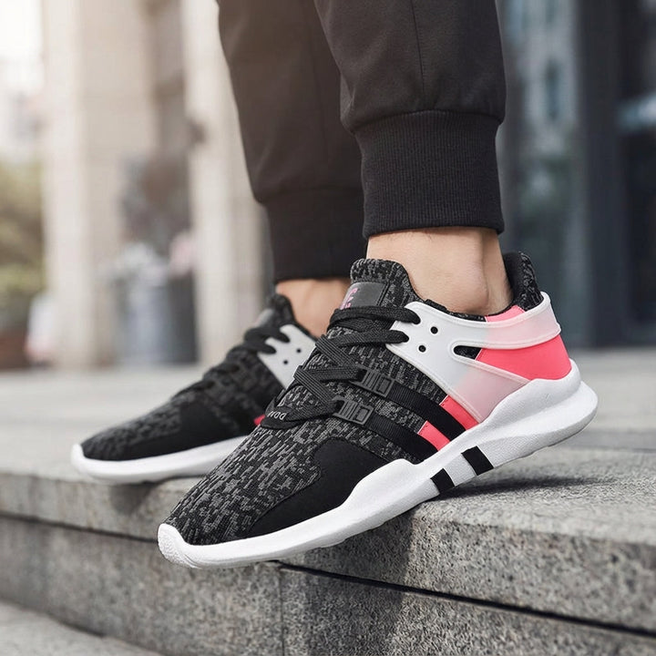 Unisex breathable athletic trainers with durable rubber sole, perfect for walking and casual wear.
