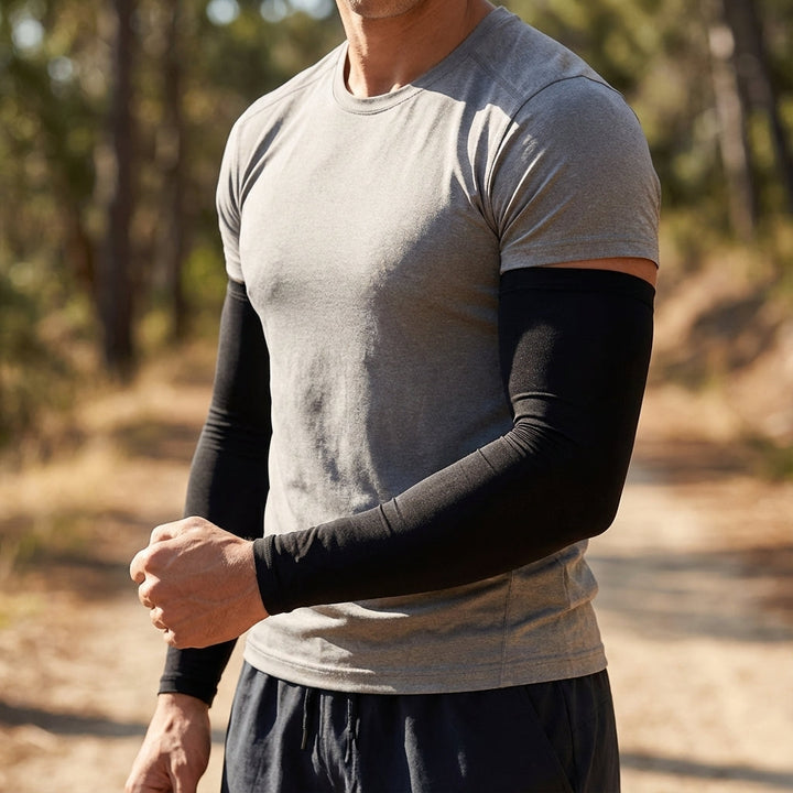 Unisex breathable sports arm sleeves in black, offering UV protection for running and cycling.