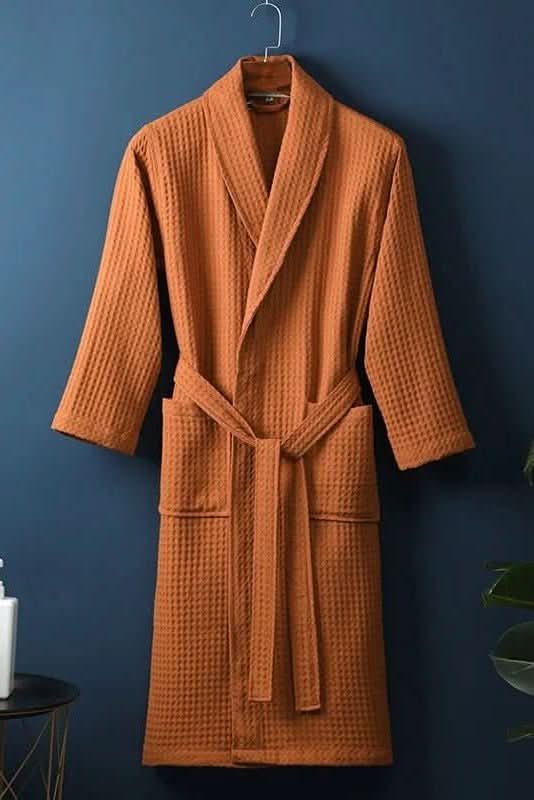 Stylish unisex waffle bathrobe in a relaxed fit, breathable home wear, offering cozy comfort & relaxation.