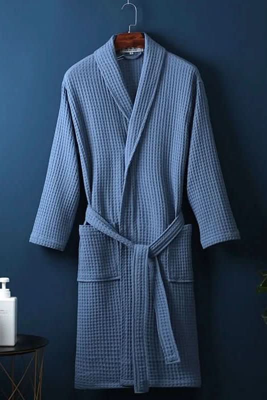 Textured waffle weave bathrobe, unisex design, breathable comfort & soft loungewear feel for relaxation.