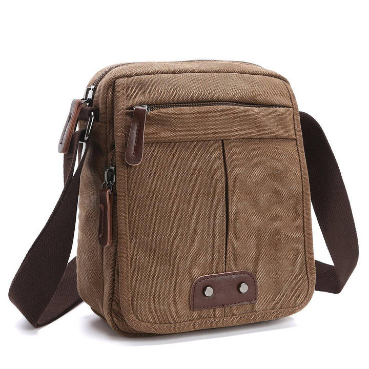Stylish unisex canvas shoulder bag. Multi-pocket design, adjustable strap for casual travel & daily use.