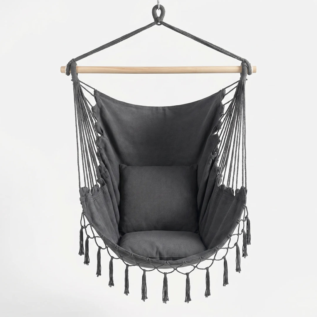 Cozy indoor swing chair with thick cushions, ideal for reading or relaxing. Space-saving hanging design.