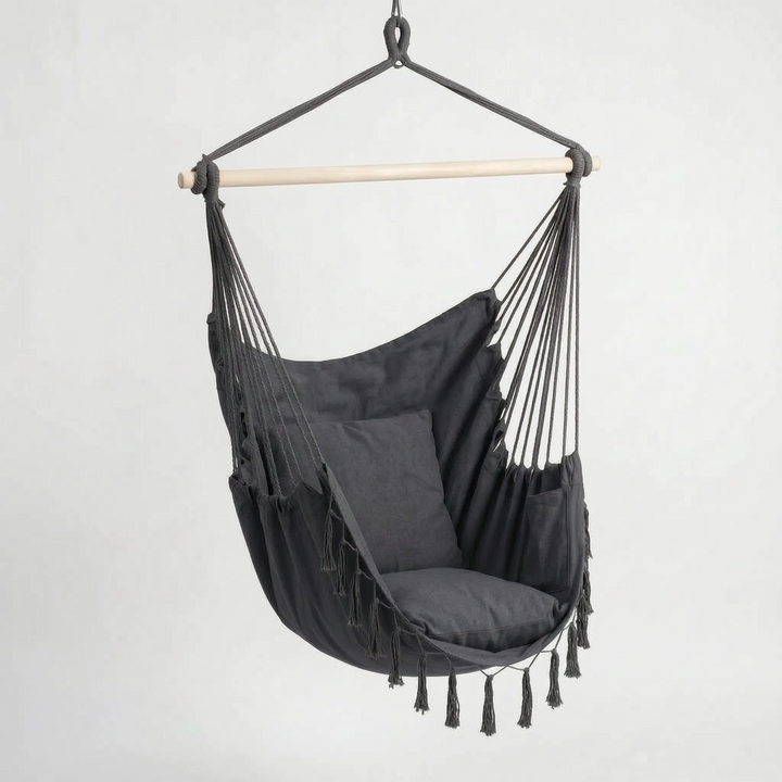 Boho hanging hammock swing chair with supportive cushions, a comfortable and chic indoor or outdoor seating option.