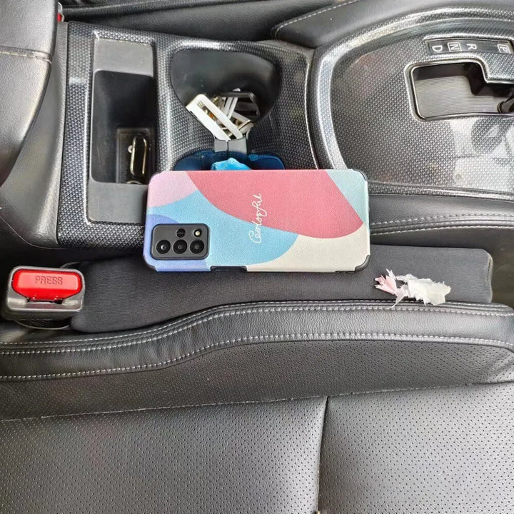 Car seat gap filler (2-pack) featuring universal fit spill-proof strips for auto organization.
