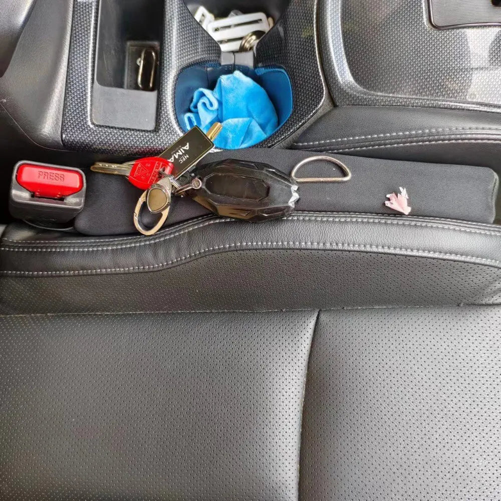 Set of two car seat gap fillers, designed as spill-proof strips to enhance vehicle storage and tidiness.