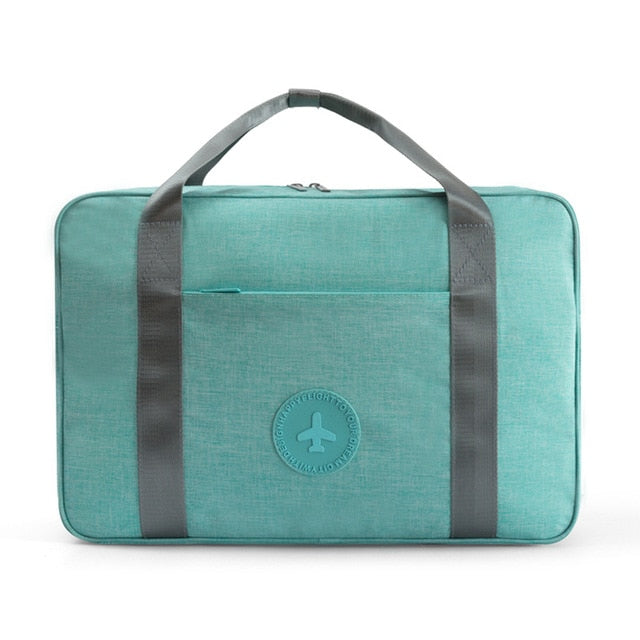 Versatile unisex carry-on travel bag, a lightweight travel accessory perfect for weekend trips or as an overhead bag.